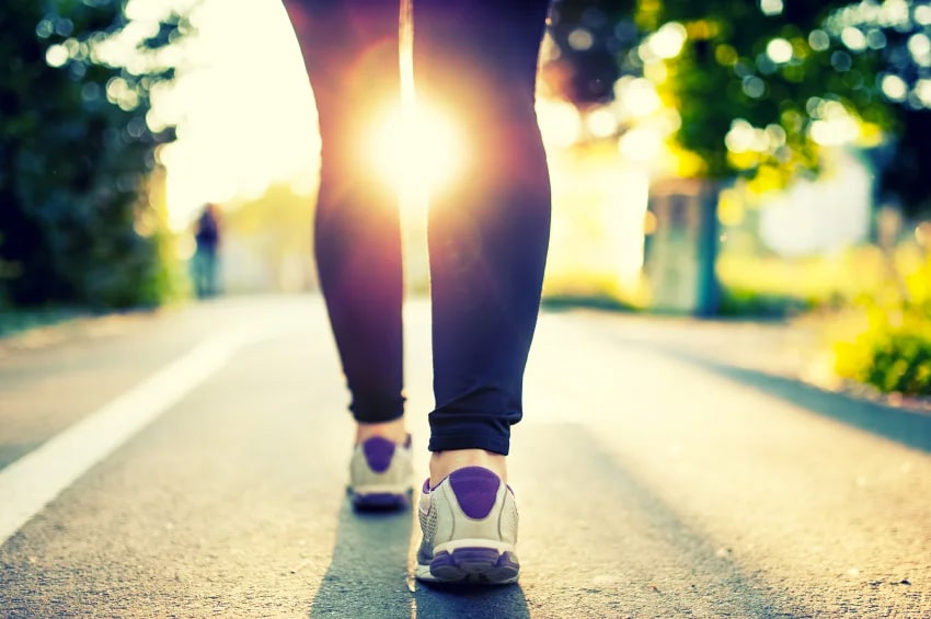 close up of woman's legs walking on a street