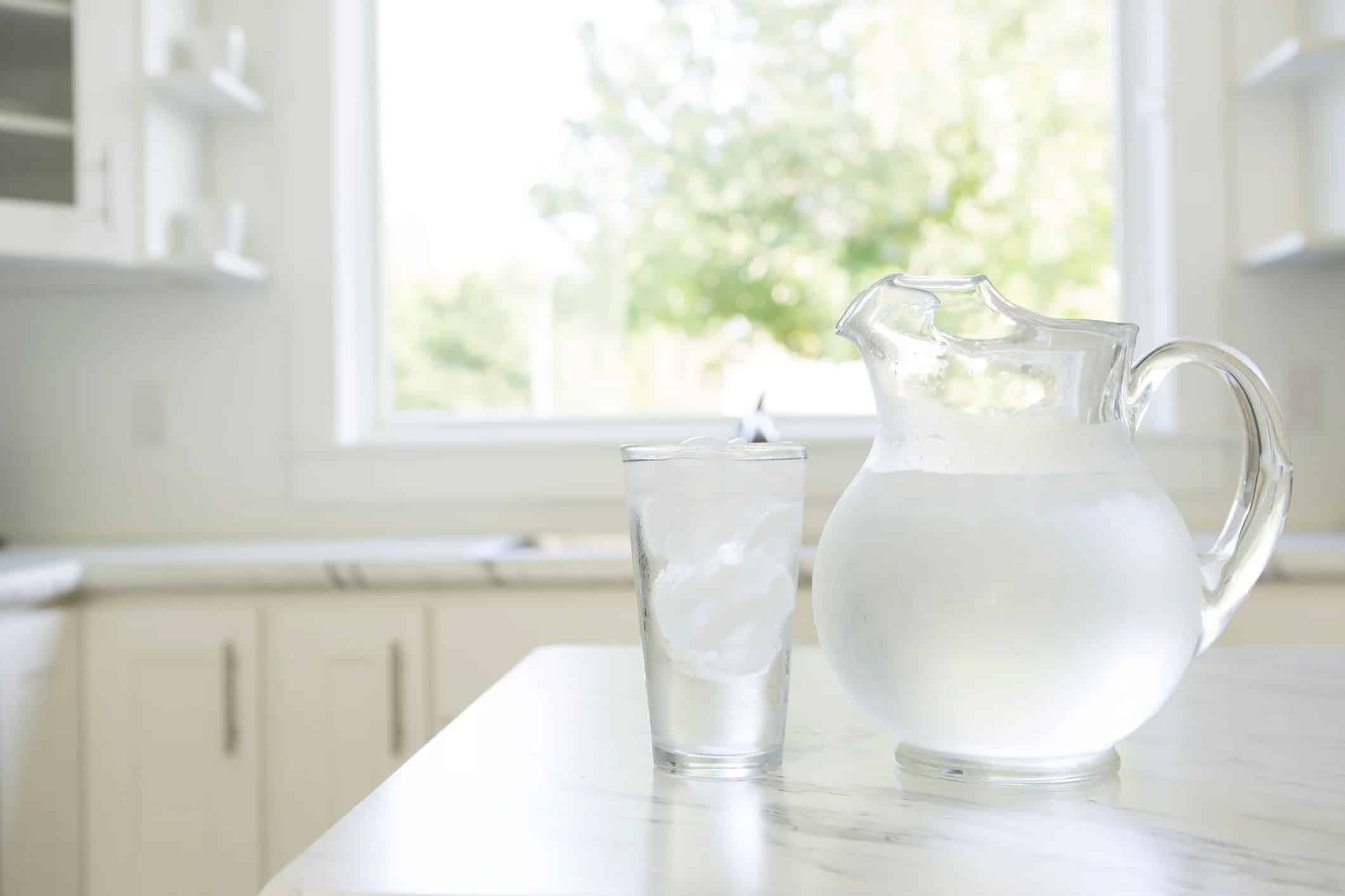 clear pitcher of ice cold water
